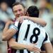 Kevin Nolan is greeted warmly by Jonas Gutierrez ahead of West Ham's clash at Newcastle
