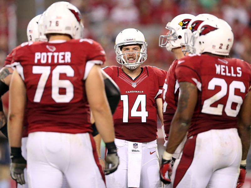 Members of the Arizona team asses their options during a 31-17 defeat against St Louis