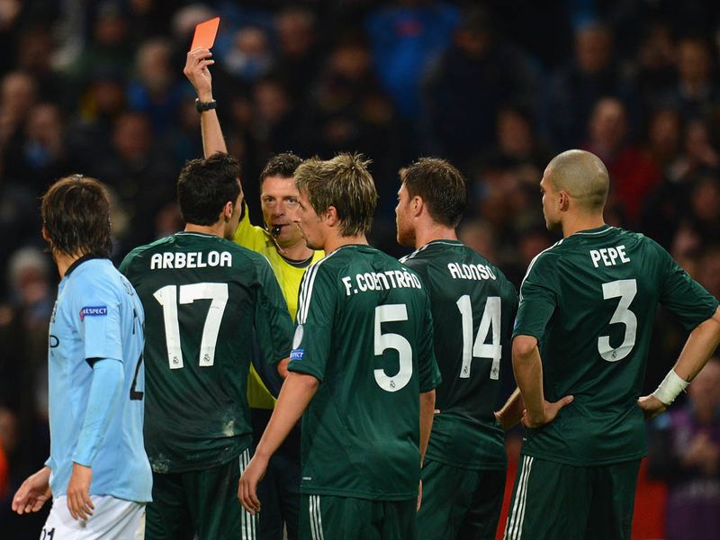 Real Madrid are reduced to ten-men, Alvaro Arbeloa is shown a second yellow card for his challenge on Aguero which lead to the penalty.