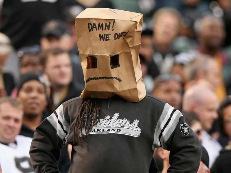 An Oakland Raiders fan is upset during their 38-17 loss to New Orleans