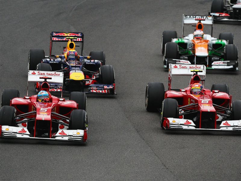The Ferrari's go wheel-to-wheel