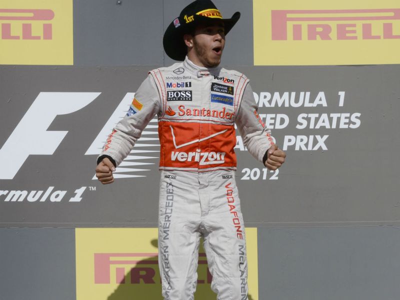 Hamilton jumps for joy on the podium