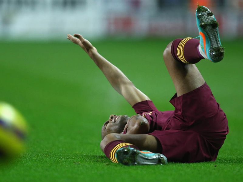 Maicon takes a ball to the throat as Man City appear to choke in the first 45 minutes at the DW Stadium.