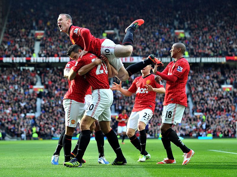 Goal joy: Manchester United celebrate Robin van Persie's early goal against Arsenal...