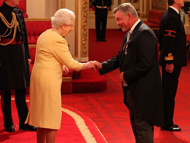 Darren Clarke meets The Queen at Buckingham palace to be awarded his OBE.