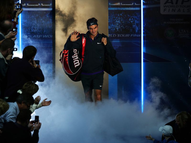 Roger Federer makes his entrance ahead of his clash with Juan Martin Del Potro