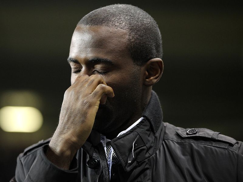 Fabrice Muamba shows emotion after a parade around the pitch at half-time