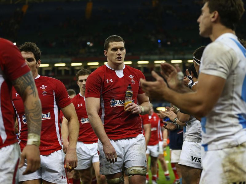 The two teams show their respect for each other at the end of the match