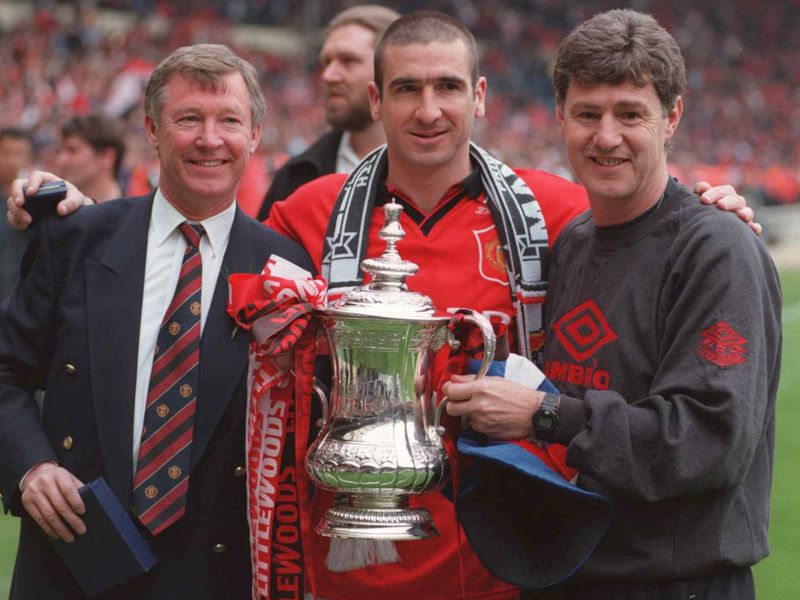 Cantona with Sir Alex Ferguson and Brian Kidd after winning the FA Cup.