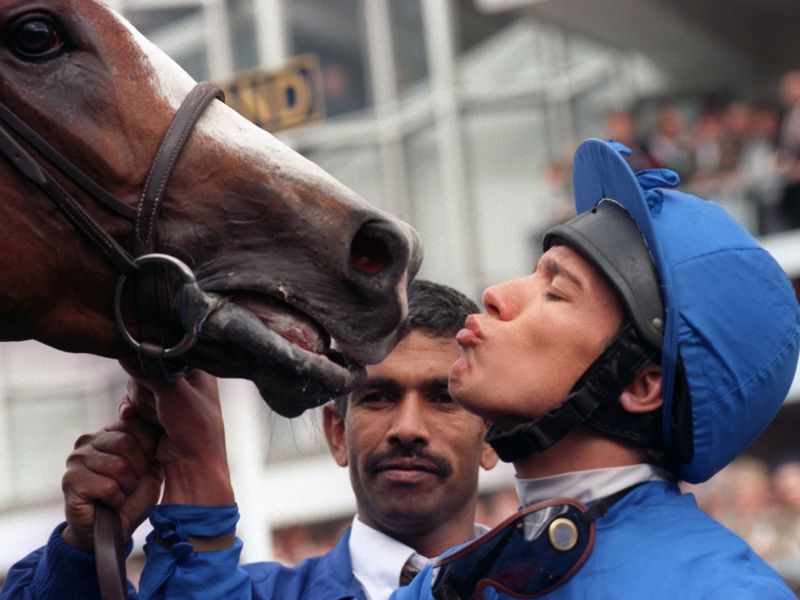 There's a kiss for Mark Of Esteem after the QEII on the day of days...