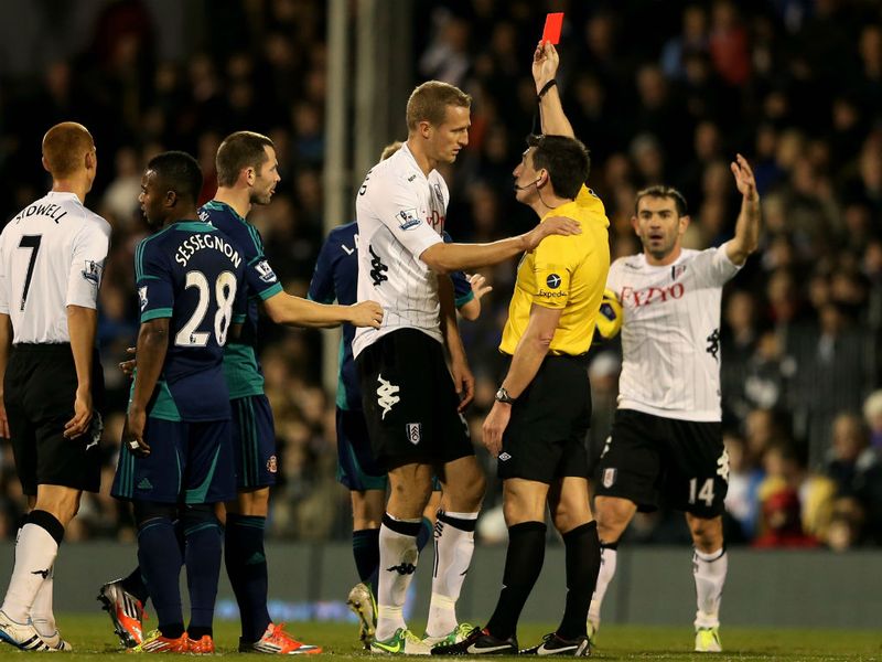Brede Hangeland is sent off by Lee Probert following a two-footed challenge on Lee Cattermole.