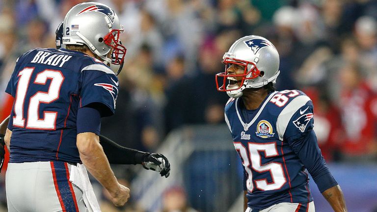 Brandon Lloyd celebrates with Tom Brady (l) after his first touchdown