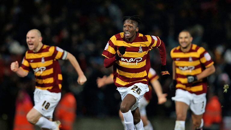 Bradford's players celebrate knocking Arsenal out at the quarter-final stage on penalties
