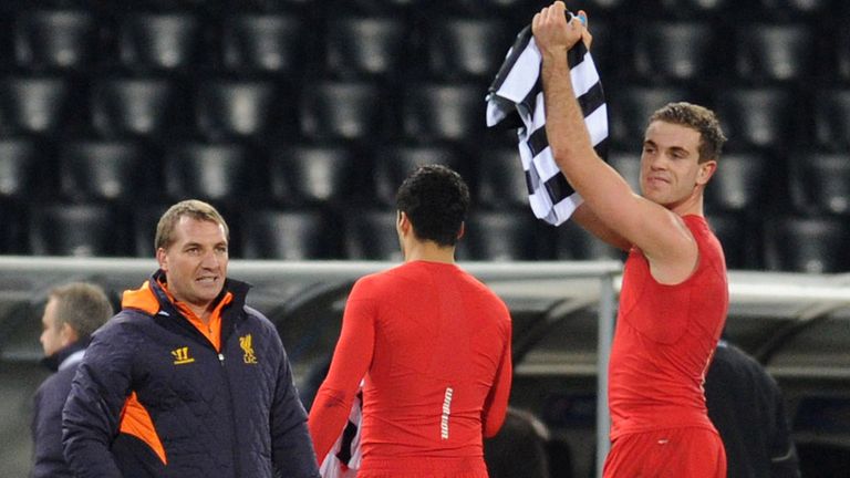 Brendan Rodgers: Looks on as Jordan Henderson salutes the Liverpool supporters