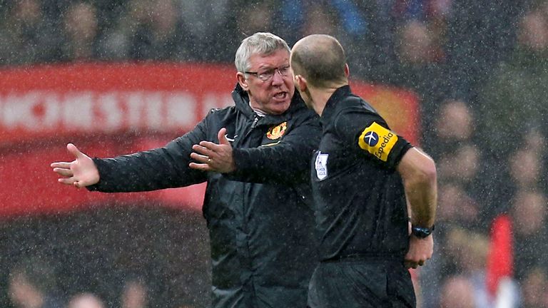 Sir Alex Ferguson confronts Mike Dean at half-time during Manchester United's victory over Newcastle