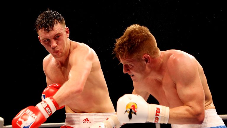 Fred Evans unleashes a heavy shot on Vjaceslav Kerber at Earls Court
