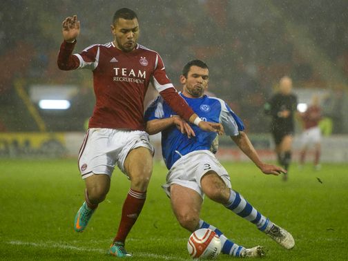 John Magennis and Callum Davidson battle for the ball
