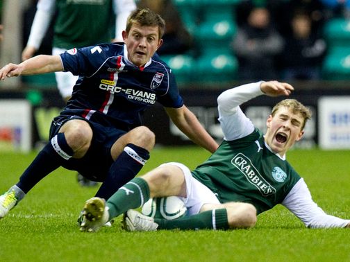 Brittain challenges Wotherspoon for the ball