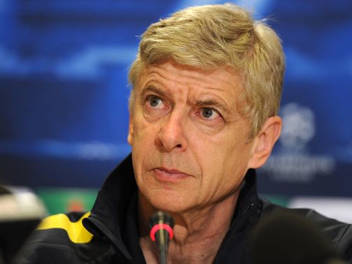 Arsene Wenger faces the press on Monday.