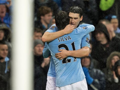 Gareth Barry celebrates his late winner for Man City
