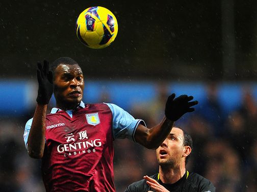Christian Benteke outjumps Ivan Ramis