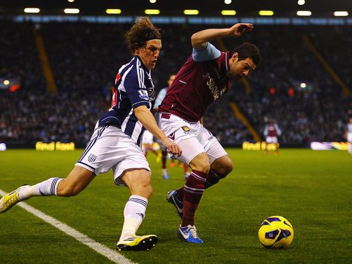 Billy Jones looks to tackle Matt Jarvis.