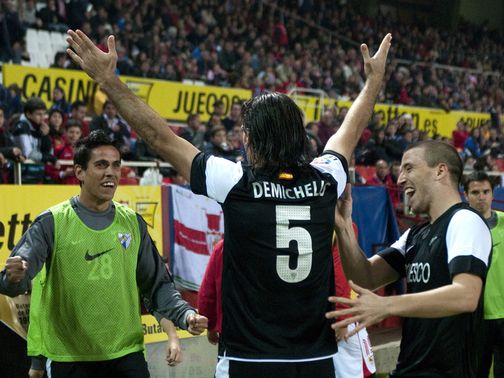 Martin Demichelis celebrates his opener for Malaga
