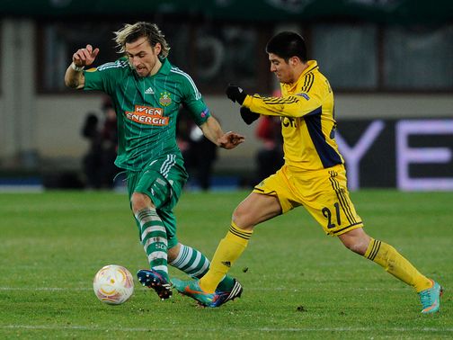 Harald Pichler and Jonathan Cristaldo battle for the ball