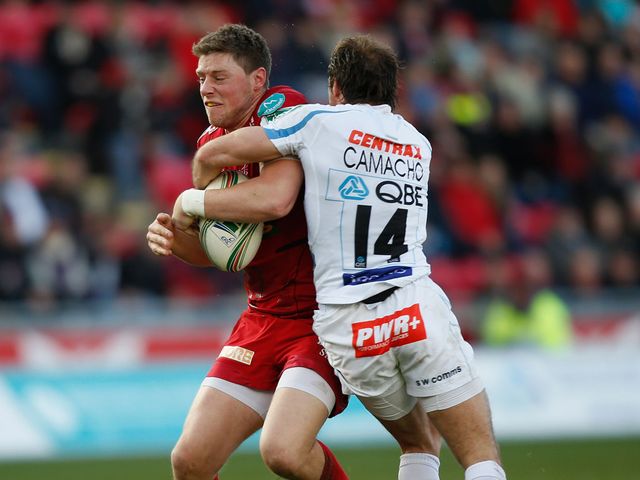 Rhys Priestland is tackled by Gonzalo Camacho