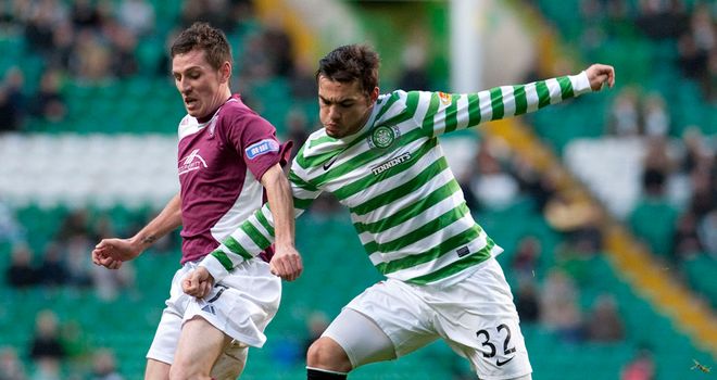 Paul Currie and Tony Watt: Battling for the ball at Parkhead