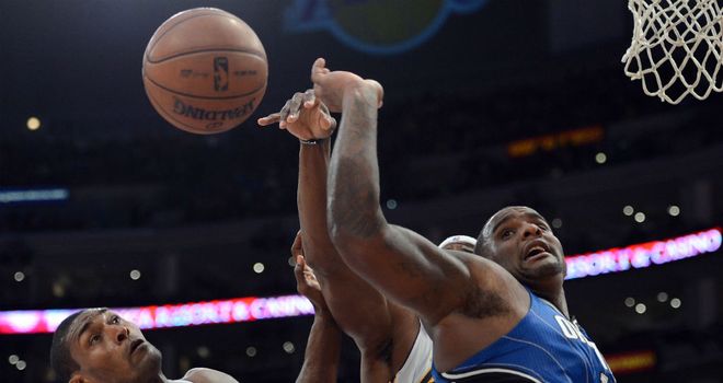 Orlando Magic's Glen Davis completes for the ball