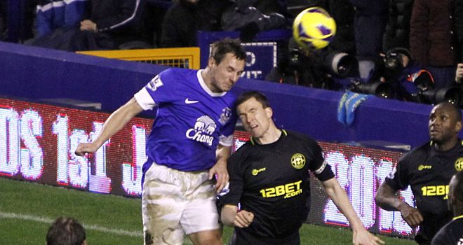 Phil Jagielka: Rises above Gary Caldwell to net what proved to be the winner