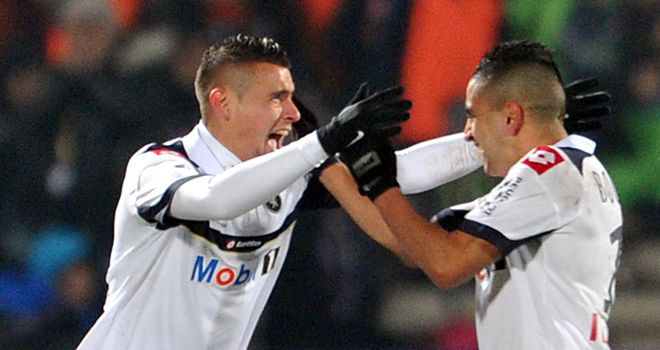 Dias (left) after his late equaliser for Sochaux