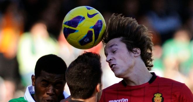 Joel Campbell and Tomas Pina Isla in aerial battle