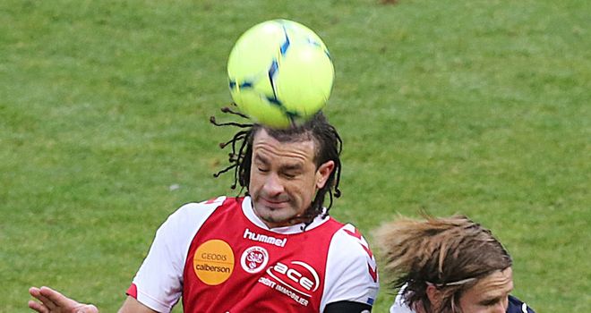 Mickael Tacalfred and Jaroslav Plasil do battle