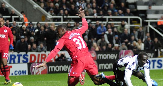 Papiss Cisse takes a tumble under the challenge of Maynor Figueroa
