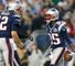 Brandon Lloyd celebrates with Tom Brady (l) after his first touchdown