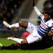 Armand Traore is tackled by Liverpool's Glen Johnson.