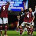 Carlton Cole receives a baffling red card, as his challenge for an aerial ball is considered dangerous play.
