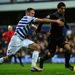 Liverpool's Luis Suarez runs past Clint Hill of QPR on his way to scoring the opening goal at Loftus Road.