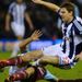 Kevin Nolan is on the wrong end of a strong challenge from West Brom's Zoltan Gera