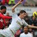 In the first game of the day, Patrice Evra heads home for Manchester United at Swansea