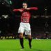 The Dutchman displays a message written on his shirt after finding the net.