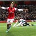 Walcott celebrates his sixth Premier League goal this season.