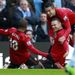 Wayne Rooney celebrates after sliding United into the lead