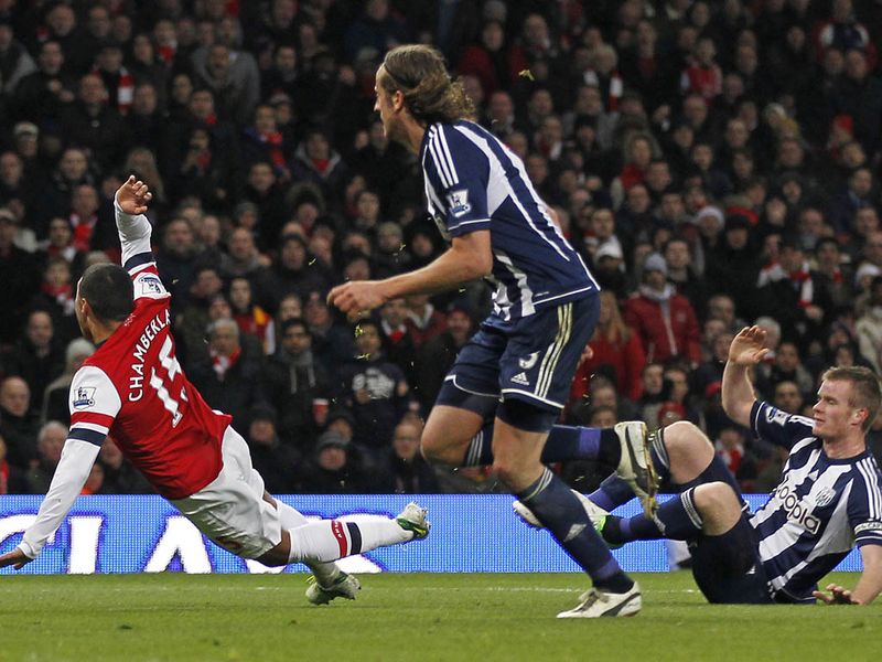On 64 minutes Chris Bunt brings Alex Oxlade-Chamberlain down in the box...