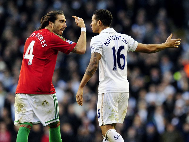 Tempers flare in injury time as Chico takes exception to the fact Tottenham played on when Michu was flat out with a head injury