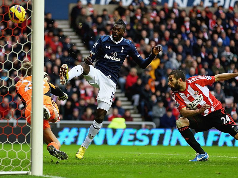 Emmanuel Adebayor is presented with a golden opportunity to put Spurs in front but somehow hits the crossbar from close range.