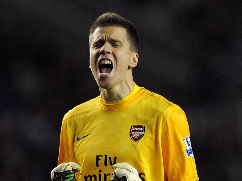 Wojciech Szczesny is having a quiet night but is certainly enjoying watching his side run riot