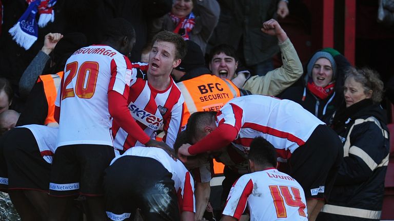 Brentford's players celebrate scoring against Chelsea